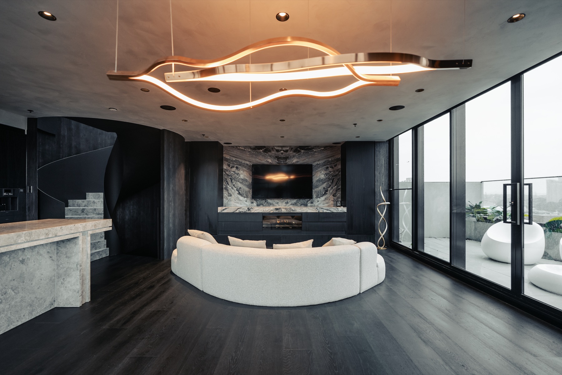 Luxury dark entertainment unit with stone television wall